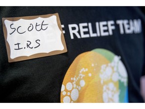 Scott, a furloughed government worker with the IRS volunteers his time to hand out free food and supplies to other furloughed government workers affected by the shutdown at World Central Kitchen, the not-for-profit organization started by Chef Jose Andres, Tuesday, Jan. 22, 2019 in Washington. The organization devoted to providing meals in the wake of natural disasters, has set up a distribution center just blocks from the U.S. Capitol building to assist those affected by the government shutdown.