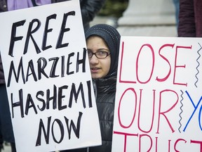 Supporters of Marzieh Hashemi, an American-born anchor for Iran's state television broadcaster, demonstrate outside the Federal Courthouse where Hashemi will appear before a U.S. grand jury, Wednesday, Jan. 23, 2019, in Washington.  She is in custody as a material witness.