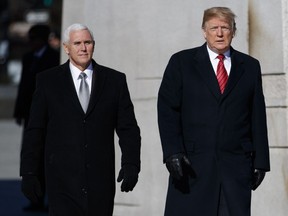 President Donald Trump and Vice President Mike Pence visit the Martin Luther King Jr. Memorial, Monday, Jan. 21, 2019, in Washington.