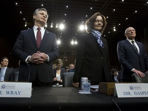 From left, FBI Director Christopher Wray, CIA Director Gina Haspel and Director of National Intelligence Daniel Coats arrive to testify before the Senate Intelligence Committee on Capitol Hill in Washington Tuesday, Jan. 29, 2019.