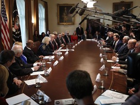 President Donald Trump, center left, leads a roundtable discussion on border security with local leaders, Friday Jan. 11, 2019, in the Cabinet Room of the White House in Washington.