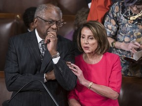 Speaker of the House Nancy Pelosi, D-Calif., talks with House Majority Whip James Clyburn, D-S.C., left, on the opening day of the 116th Congress as the Democrats take the majority from the GOP, at the Capitol in Washington, Thursday, Jan. 3, 2019.