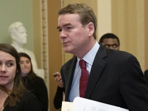 Sen. Michael Bennet, D-Colo., leaves the chamber after an emotional speech on the Senate floor over the partial government shutdown, at the Capitol in Washington, Thursday, Jan. 24, 2019.