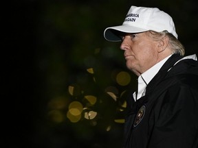 President Donald Trump walks on the South Lawn of the White House in Washington, Thursday, Jan. 10, 2019, after returning from a trip to the southern border.