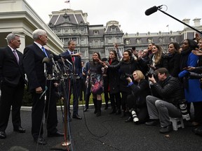 Vice President Mike Pence, second from left, standing with House Minority Leader Kevin McCarthy of Calif., left, and Sen. John Thune, R-S.D., third from left, calls on a reporter following a meeting with President Donald Trump and Democratic leaders at the White House in Washington, Wednesday, Jan. 9, 2019.