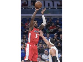 Washington Wizards forward Jeff Green (32) goes up for a shot in front of Orlando Magic forward Aaron Gordon during the first half of an NBA basketball game Friday, Jan. 25, 2019, in Orlando, Fla.