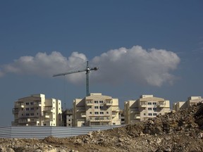 This Tuesday, Jan. 1, 2019 photo, shows a new housing project in a West Bank settlement of Modiin Ilit. Data obtained by The Associated Press shows that the Israeli government -- with little resistance from a friendly White House -- has gone on a settlement push in the West Bank since President Donald Trump took office. That has laid the groundwork for what could be the largest binge in construction in years.