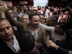 FILE - In this Wednesday, Nov. 14, 2018 file photo, Spain's far-right Vox Party President Santiago Abascal, arrives at a party rally in Murcia, Spain. Spain's new far-right Vox party is edging toward the political mainstream, dropping its more extremist positions to help form a regional government in Andalucia, according to a new political alliance announced late Wednesday Jan. 9, 2019.