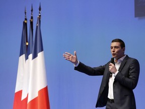 French far-right member Jordan Bardella delivers his speech during a campaign meeting in Paris, Sunday, Jan. 13, 2019. Marine Le Pen's French far right party National Rally has launched Sunday its campaign for the European Parliament elections, and has appointed 23-year-old Jordan Bardella to lead its election campaign.