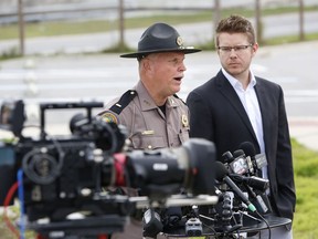 Florida Highway Patrol Lt. Pat Riordan, left, along with Troy Roberts, the spokesperson for the Florida Department of Transportation,  updates members the media during a press conference, Friday, Jan. 4, 2019, in Gainesville, Fla., about a fiery highway crash the day before that killed at least seven people.