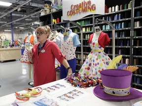 In this Wednesday, Jan. 9, 2019 photo, Harmony McChesney, costume designer discusses the work that goes in to creating costumes at Walt Disney World in Lake Buena Vista, Fla. Durability is a must since the costumes worn by dancers, singers and costumed characters are washed every day.