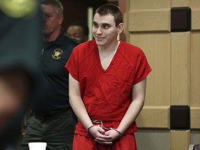 Parkland school shooting suspect Nikolas Cruz enters the courtroom for a hearing at the Broward Courthouse in Fort Lauderdale, Fla., Tuesday, Jan. 15, 2019. Cruz returned court this week for hearings on the Valentine's Day 2018 shooting at Marjory Stoneman Douglas High School in Parkland, Fla., and on accusations he assaulted a corrections officer.
