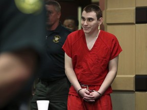 Parkland school shooting suspect Nikolas Cruz enters the courtroom for a hearing at the Broward Courthouse in Fort Lauderdale, Fla., Tuesday, Jan. 15, 2019. Cruz returned court this week for hearings on the Valentine's Day 2018 shooting at Marjory Stoneman Douglas High School in Parkland, Fla., and on accusations he assaulted a corrections officer.