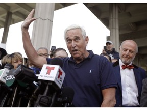 Roger Stone, a confidant of President Donald Trump, speaks outside of the federal courthouse following a hearing, Friday, Jan. 25, 2019, in Fort Lauderdale, Fla. Stone was arrested Friday in the special counsel's Russia investigation and was charged with lying to Congress and obstructing the probe.