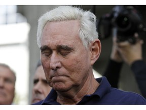 Roger Stone, a confidant of President Donald Trump, stands outside of the federal courthouse following a hearing, Friday, Jan. 25, 2019, in Fort Lauderdale, Fla. Stone was arrested Friday in the special counsel's Russia investigation and was charged with lying to Congress and obstructing the probe.