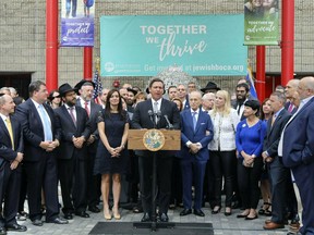 Florida Gov. Ron DeSantis speaks at a press conference at the Jewish Federation of South Palm Beach County in Boca Raton, Fla. Tuesday, Jan. 15, 2019. DeSantis says he is pushing for sanctions against Airbnb unless it reverses its decision barring lodging listings in the disputed West Bank in the Middle East.