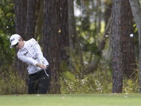 Eun-Hee Ji, of South Korea, hits out of the rough along the first fairway during the final round of the Tournament of Champions LPGA golf tournament Sunday, Jan. 20, 2019, in Lake Buena Vista, Fla.