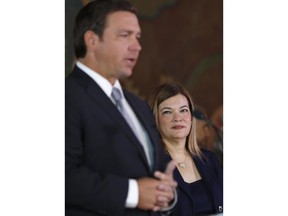 Barbara Lagoa, right, looks on as Governor Ron DeSantis introduces her as his pick for the Florida Supreme Court, Wednesday, Jan. 9, 2019, in Miami.