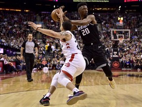 Toronto Raptors guard Fred VanVleet (23) swipes the ball from Sacramento Kings forward Harry Giles (20) during second half NBA basketball action in Toronto on Tuesday, Jan. 22, 2019.