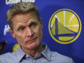 FILE - In this June 11, 2018 file photo, Golden State Warriors coach Steve Kerr listens during a media conference in Oakland, Calif. Luke Walton began a wellness program for his Lakers coaching staff. Steve Kerr called Steve Clifford in support after each spent significant time away from the sideline because of debilitating headaches among other symptoms. The NBA Coaches Association now provides guidance to its members on everything from diet and exercise to sleep and mental health.