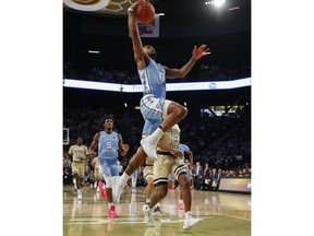 North Carolina guard Seventh Woods (0) dunks during the first half of an NCAA college basketball game against Georgia Tech in Atlanta, Tuesday, Jan. 29, 2019.