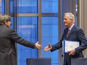 European Parliament Brexit coordinator Guy Verhofstadt, left, greets European Union chief Brexit negotiator Michel Barnier at the start of a Brexit Steering Group meeting at the European Parliament in Brussels on Wednesday Jan. 30, 2019. British Prime Minister Theresa May on Tuesday won a few weeks to salvage a Brexit deal but headed toward a clash with the European Union by promising to overhaul the divorce agreement she spent a year and a half negotiating with the bloc.