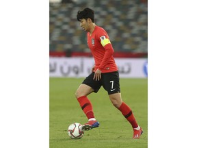 South Korea's forward Son Heung-Min runs with the ball during the AFC Asian Cup quarterfinal soccer match between Korea Republic and Qatar at the Zayed Sport City Stadium in Abu Dhabi, United Arab Emirates, Friday, Jan. 25, 2019.