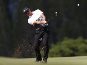 Gary Woodland hits from the fourth fairway during the second round of the Tournament of Champions golf event, Friday, Jan. 4, 2019, at Kapalua Plantation Course in Kapalua, Hawaii.