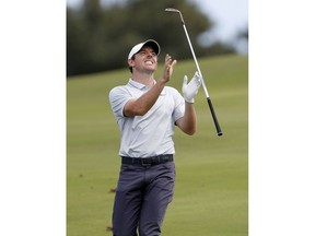 Rory McIlroy tosses his club after his approach shot on the 12th green during the third round of the Tournament of Champions golf event, Saturday, Jan. 5, 2019, at Kapalua Plantation Course in Kapalua, Hawaii.