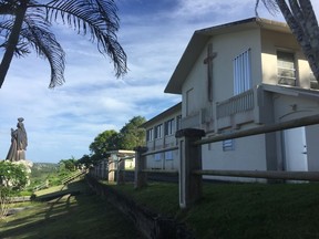 FILE - This Nov. 7, 2018 file photo shows the residence and office of the Archbishop of Agana in Hagatna, Guam. Guam's Catholic Church has filed for bankruptcy, a move that will allow the archdiocese to avoid trial in dozens of child sexual abuse lawsuits and enter settlement negotiations. Ford Elsaesser, an attorney representing the church, says the Chapter 11 bankruptcy petition was filed Wednesday, Jan. 16, 2019 with federal court in Guam. The church faces multi-million dollar lawsuits for sexual abuse from about 190 accusers.