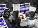 Government workers rally against the partial government shutdown at Federal Plaza, Thursday, Jan. 10, 2019, in Chicago. The partial government shutdown continues to drag on with hundreds of thousands of federal workers off the job or working without pay as the border wall fight persists.