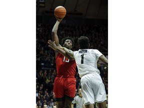 Rutgers forward Shaq Carter, left, shoots over Purdue forward Aaron Wheeler during the first half of an NCAA college basketball game in West Lafayette, Ind., Tuesday, Jan. 15, 2019.