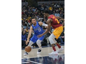 Dallas Mavericks guard Jalen Brunson (13) dribbles against Indiana Pacers forward Thaddeus Young during the first half of an NBA basketball game in Indianapolis, Saturday, Jan. 19, 2019.