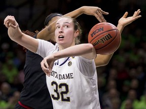 Notre Dame's Jessica Shepard (32) has the ball knocked away from behind by Louisville's Bionca Dunham during the first half of an NCAA college basketball game Thursday, Jan. 10, 2019, in South Bend, Ind.