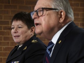 RCMP Commissioner Brenda Lucki, left, listens as Minister of Public Safety and Emergency Preparedness Ralph Goodale speaks during a press conference on the RCMP's new Interim Management Advisory Board in Ottawa on Wednesday, Jan. 16, 2019.