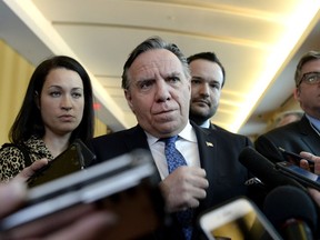 Quebec Premier Francois Legault listens to a questions from reporters before attending a cabinet meeting in Gatineau, Que., on Tuesday, Jan. 29, 2019.