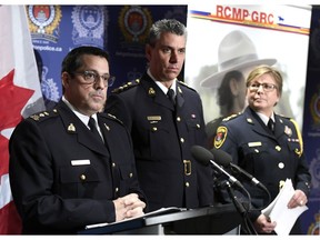 Supt. Peter Lambertucci, left, Officer in Charge INSET Ottawa answers questions from reporters as Chief Supt. Michael LeSage, Criminal Operations Officer, RCMP "O" Division and Kingston Police chief Antje McNeely look on during a press conference, after RCMP charged a youth with terrorism, in Kingston, Ont. on Friday, Jan. 25, 2019.