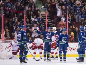 Vancouver Canucks left wing Antoine Roussel (26) celebrates his goal against the Detroit Red Wings during third period NHL action in Vancouver, Sunday, Jan 20, 2019.