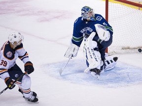 Edmonton Oilers right wing Alex Chiasson (39) sends the game-winning shootout goal past Vancouver Canucks goaltender Jacob Markstrom (25) to end NHL action at Rogers Arena in Vancouver, Wednesday, Jan. 16, 2019.