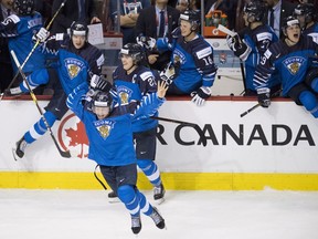 Team Finland celebrates their gold medal win over the United States following third period IIHF world junior hockey final action in Vancouver, Saturday, Jan. 5, 2019.