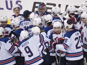 Team United States celebrates their win over Russia following third period IIHF world junior semifinal hockey action in Vancouver, Friday, Jan. 4, 2019.
