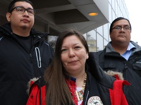 Melissa Stevenson, centre, stands outside the Winnipeg courthouse with Henry McKay, left, and Travis Bighetty after Christopher Brass was sentenced to 15 years for manslaughter in the shooting death of Stevenson's best friend, 29-year-old Jeanenne Fontaine, on Wednesday, Jan. 23, 2019.