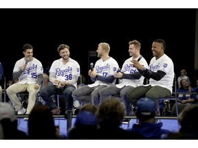 Kansas City Royals players Whit Merrifield (15), Cam Gallagher (36), Hunter Dozier (17), Ryan O'Hearn and Salvador Perez, right, answer questions from the crowd while appearing at the Royals Fanfest event Friday, Jan. 25, 2019, at Bartle Hall convention center in Kansas City, Mo.