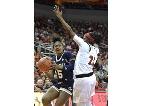 Georgia Tech guard Elizabeth Balogun (5) prepares to shoot over the defense of Louisville guard Jazmine Jones (23) during the first half of an NCAA college basketball game in Louisville, Ky., Sunday, Jan. 13, 2019.