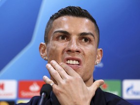 FILE - In this Oct. 22, 2018, file photo, Juventus' Cristiano Ronaldo attends a press conference at Old Trafford, Manchester. Ronaldo is being asked by police in the U.S. to provide a DNA sample in an ongoing investigation of a Nevada woman's allegation that he raped her in his Las Vegas hotel penthouse in 2009, the soccer star's lawyer in Las Vegas said Thursday, Jan. 10, 2019. England.