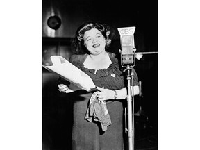 FILE - In this Jan. 1, 1944 file photo, Mildred Bailey, a jazz singer of the Coeur d'Alene American Indian tribe, performs on her musical radio program "Mildred Bailey and Company" in New York City. "RUMBLE: The Indians Who Rocked the World," a new PBS Independent Lens documentary set to air Monday, Jan 21, 2019, shows how Native Americans laid the foundations to rock, blues and jazz. (AP Photo, File)