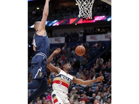 New Orleans Pelicans guard Ian Clark (2) battles under the basket with Denver Nuggets forward Mason Plumlee during the first half of an NBA basketball game in New Orleans, Wednesday, Jan. 30, 2019.