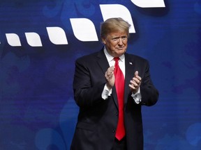 President Donald Trump acknowledges the crowd after speaking at the American Farm Bureau Federation convention in New Orleans, Monday, Jan. 14, 2019.