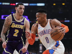 Oklahoma City Thunder's Russell Westbrook, right, drives past Los Angeles Lakers' Lonzo Ball during the first half of an NBA basketball game Wednesday, Jan. 2, 2019, in Los Angeles.