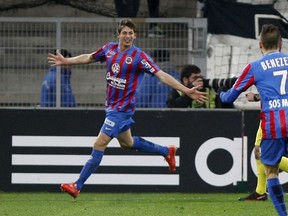 FILE - In this Friday, Feb. 27, 2015 file photo, Caen's forward Emiliano Sala celebrates scoring against Marseille during the League One soccer match between Marseille and Caen, at the Velodrome Stadium, in Marseille, southern France. The French civil aviation authority said Tuesday Jan. 22, 2019, Argentine soccer player Emiliano Sala was aboard a small passenger plane that went missing off the coast of the island of Guernsey. French and British maritime authorities are searching the English Channel for the plane.